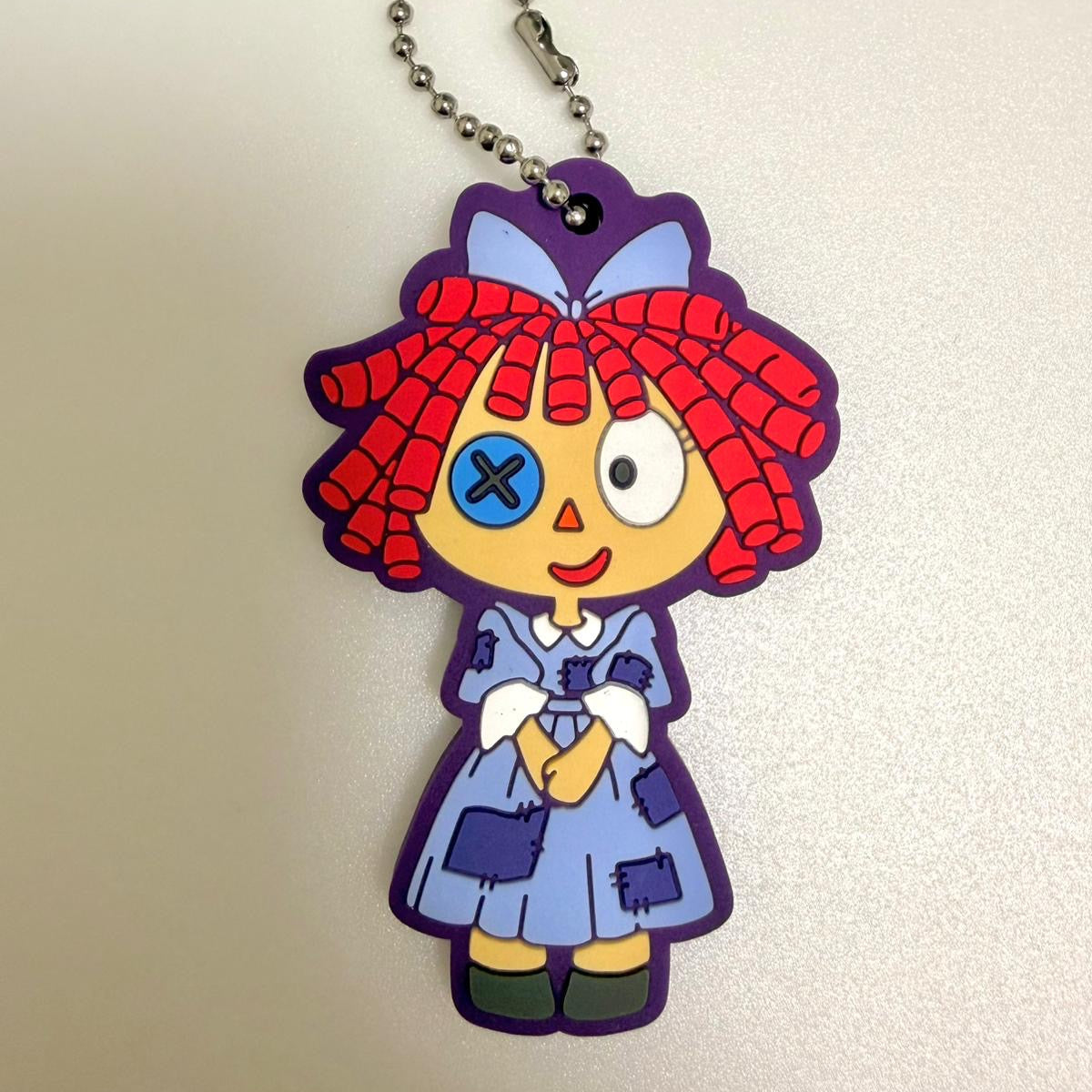The Amazing Digital Circus Ragatha rubber keychain by Bandai